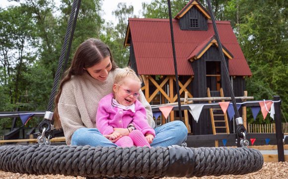 Little Girl with Cerebral Palsy Delights at New Inclusive Play Attraction